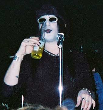 Taime Downe drinking crappy beer, probably laced with some narcotic